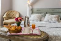 Ένα ή περισσότερα κρεβάτια σε δωμάτιο στο Hôtel du Parc