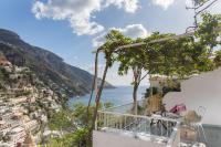 a view of the amalfi coast from the balcony of a house at Hotel Poseidon in Positano