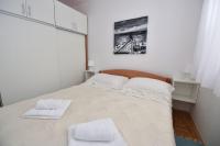 Postel nebo postele na pokoji v ubytování Vicy Apartment Novalja