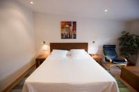 Posteľ alebo postele v izbe v ubytovaní Hotel Cal Naudi