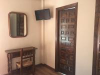 Televízia a/alebo spoločenská miestnosť v ubytovaní Hostal Argentino