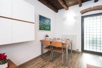 a dining room with a table and chairs at Villa Broglia House in Verona