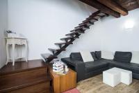 a living room with a couch and a table at Villa Broglia House in Verona