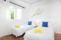 Postel nebo postele na pokoji v ubytování Villa Cala Padri