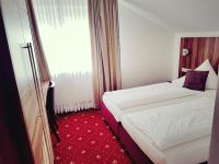 Postel nebo postele na pokoji v ubytování Hotel Spechtshaardt