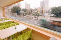 a window in a restaurant with a view of a street at Kiwi Express Hotel - Zhong Zheng Branch in Taichung