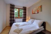Łóżko lub łóżka w pokoju w obiekcie Przytulny i Gustowny Apartament Sun Seasons 24 w Karpaczu by Noclegi Renters