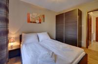 Łóżko lub łóżka w pokoju w obiekcie Przytulny i Gustowny Apartament Sun Seasons 24 w Karpaczu by Noclegi Renters
