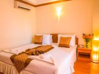 Postel nebo postele na pokoji v ubytování Chomsin Hua Hin ชมสินธุ์ หัวหิน