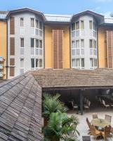 a view of a building from the patio of a hotel at Hotel Maharajah in Mamoudzou