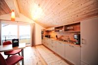 Kuchyň nebo kuchyňský kout v ubytování Hotel Dorfstadl