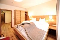Postel nebo postele na pokoji v ubytování Hotel Dorfstadl