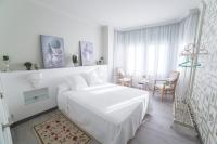 Postel nebo postele na pokoji v ubytování Gr Suites Boutique Alcazaba