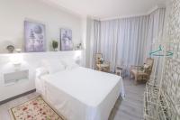 Postel nebo postele na pokoji v ubytování Gr Suites Boutique Alcazaba