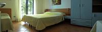 Łóżko lub łóżka w pokoju w obiekcie Verdeblu Country Hotel