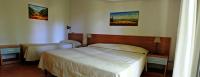 Łóżko lub łóżka w pokoju w obiekcie Verdeblu Country Hotel