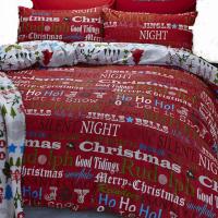 a bed with red and white blankets and pillows at Plagne AIME 2000 Ski Apartments in Aime-La Plagne