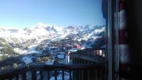 a view of a snow covered mountain from a balcony at Plagne AIME 2000 Ski Apartments in Aime-La Plagne