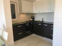 Kuchyň nebo kuchyňský kout v ubytování Apartments Victoria Privlaka