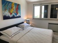 Postel nebo postele na pokoji v ubytování Apartments Victoria Privlaka