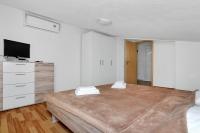 Posteľ alebo postele v izbe v ubytovaní Apartmani Cico