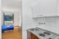 Kuchyňa alebo kuchynka v ubytovaní Apartmani Cico