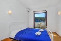 Posteľ alebo postele v izbe v ubytovaní Apartmani Cico