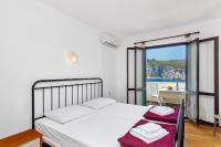 Posteľ alebo postele v izbe v ubytovaní Apartmani Cico