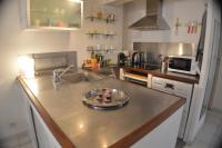 a kitchen with a sink and a counter top at Studio loft avec terrasse centre historique in Ajaccio
