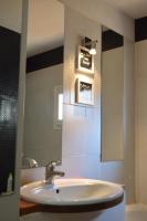 a bathroom with a sink and a mirror at Studio loft avec terrasse centre historique in Ajaccio