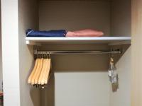 a towel rack in a bathroom with wooden utensils at Kyoto Inn Gion The Second in Kyoto