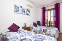 A bed or beds in a room at Villa Julianne 1