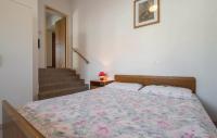 Postel nebo postele na pokoji v ubytování Apartments Biserka 1495