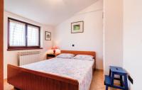 Postel nebo postele na pokoji v ubytování Apartments Biserka 1495