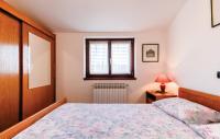 Postel nebo postele na pokoji v ubytování Apartments Biserka 1495