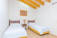 A bed or beds in a room at Sa Mata