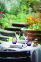 a table with three wine glasses on it at Auberge d'Anthy in Anthy