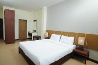Postel nebo postele na pokoji v ubytování Mawin Hotel
