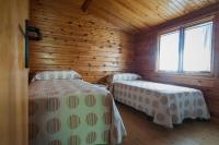 Cama o camas de una habitación en Camping & Bungalows Ligüerre de Cinca
