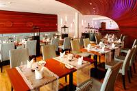 a dining room with tables and chairs in a restaurant at Hapimag Ferienwohnungen Binz in Binz