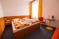 Postel nebo postele na pokoji v ubytování Hotel Morava