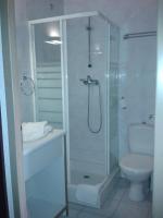 a bathroom with a shower and a toilet at Hotel Val Joly in Saint-Gervais-les-Bains