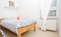 Postel nebo postele na pokoji v ubytování Apartman Kimi