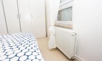 Postel nebo postele na pokoji v ubytování Apartman Kimi
