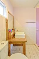 a bathroom with a sink and a toilet at Love Summer Hostel in Hengchun South Gate