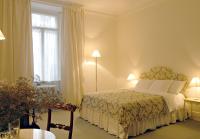 A bed or beds in a room at Milano Suites