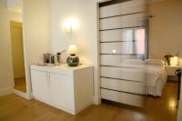 A bed or beds in a room at Milano Suites