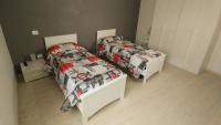 Posteľ alebo postele v izbe v ubytovaní Casa Roncalli