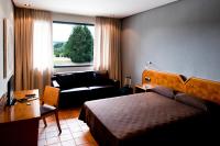 Łóżko lub łóżka w pokoju w obiekcie AS Hoteles Altube
