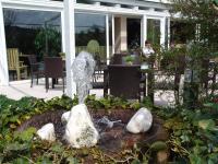 a garden with rocks in the middle of a yard at Hotel Blankenfeld in Wetzlar